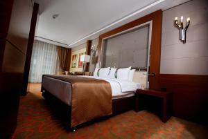 A bed or beds in a room at Holiday Inn Ankara-Kavaklidere by IHG