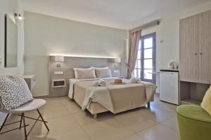 Ένα ή περισσότερα κρεβάτια σε δωμάτιο στο Nereus Luxurious Suites