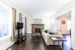 a living room with a couch and a fireplace at Home in Heart of Salt Lake City Home in Salt Lake City