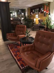Uma área de estar em Hildibrand Apartment Hotel