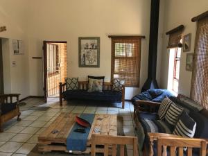 a living room with a couch and a coffee table at Jbay Tides in Jeffreys Bay