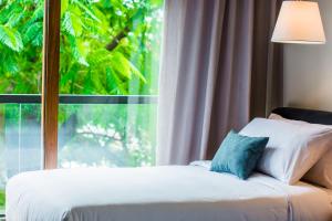 A bed or beds in a room at Five Hotel & Residences