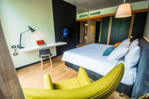 A bed or beds in a room at Five Hotel & Residences