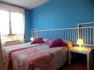 A bed or beds in a room at www Apartamento Conde de León wordpress com Parking opcional