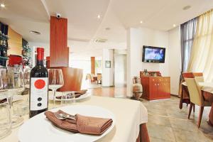 a bottle of wine sitting on a table in a room at Vilola in Umag
