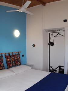 Łóżko lub łóżka w pokoju w obiekcie Casa Vacanze Bungalow I Girasoli