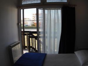 Łóżko lub łóżka w pokoju w obiekcie Casa Vacanze Bungalow I Girasoli