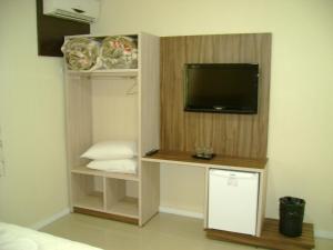 TV a/nebo společenská místnost v ubytování Hotel Real
