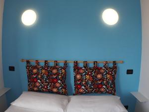 Łóżko lub łóżka w pokoju w obiekcie Casa Vacanze Bungalow I Girasoli