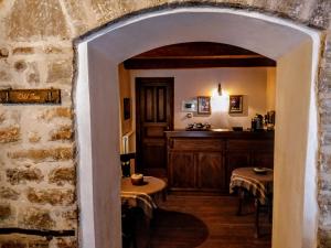 an archway leading to a kitchen in a building at Old Inn in Karpenisi