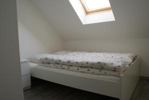 Ένα ή περισσότερα κρεβάτια σε δωμάτιο στο Guest House K74