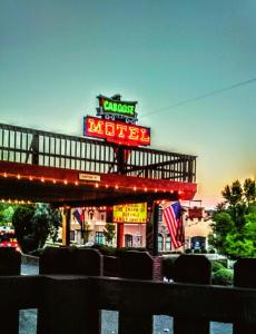 a motel with a sign on top of it at Caboose Motel & Gift Shop in Durango