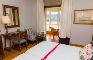 Cama o camas de una habitación en Parador de Ribadeo