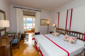 Cama o camas de una habitación en Parador de Ribadeo