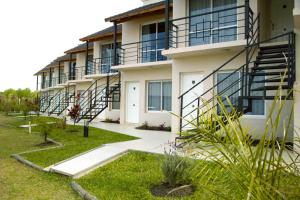 a building with stairs on the side of it at Brisas del Lago Apartamentos in Colón