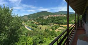 a view of a valley from the balcony of a house at bed and breakfast "il Picchio Verde" in Cittaducale
