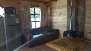 Posezení v ubytování HelChiloé Cabañas