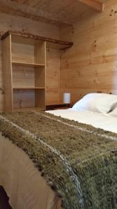 Postel nebo postele na pokoji v ubytování HelChiloé Cabañas
