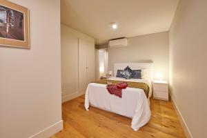 Кровать или кровати в номере Modern Apartment Bica dos Olhos