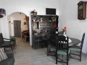 a living room with a table and a dining room at La Loberia - Las Grutas in Las Grutas +20 photos
