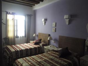 Postel nebo postele na pokoji v ubytování El Sueño de Lucrecia + 34 fotografií