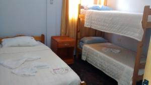 Una cama o camas en una habitación de Guatambu Apart