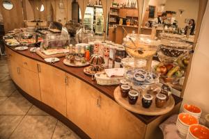 a kitchen filled with lots of different types of food at Hotel SET in Bratislava