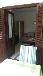 a room with a door open to a living room at Apartments Šorić in Rovinj