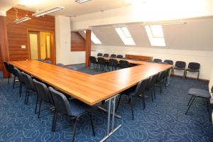 a large conference room with a long table and chairs at Domačija Vodnik & Apartments in Cerklje na Gorenjskem