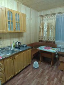 A kitchen or kitchenette at Lyubava Guest House