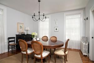 a dining room with a table and chairs at Hudson B&B in Hudson
