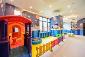 a childs play room with a toy house at Somerset Harmony City Wuxi in Wuxi