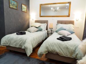 Ένα ή περισσότερα κρεβάτια σε δωμάτιο στο Deluxe Zoya Centar