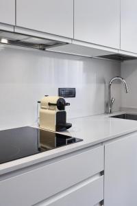 a kitchen with a toaster sitting on a counter at La Perla by Sedar in Como