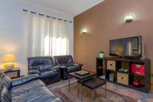 TV a/nebo společenská místnost v ubytování Hotel Adria
