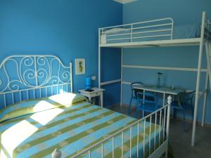 En eller flere senge i et værelse på L'alberghetto Milazzo