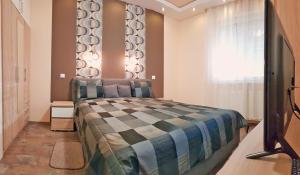 Postel nebo postele na pokoji v ubytování Central-Aqua Apartman