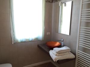 a bathroom with a sink and a bowl on a counter at ApartmentsPadova in Padova +30 photos