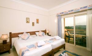 Postel nebo postele na pokoji v ubytování 4S Hotel Dahab + 37 fotografií