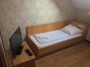 Postel nebo postele na pokoji v ubytování Vénusz Panzió és Vendéglő