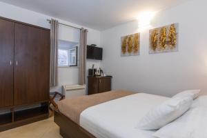 Posteľ alebo postele v izbe v ubytovaní Villa Four Winds II