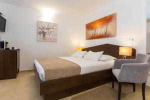 Posteľ alebo postele v izbe v ubytovaní Villa Four Winds II
