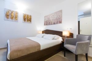 Posteľ alebo postele v izbe v ubytovaní Villa Four Winds II