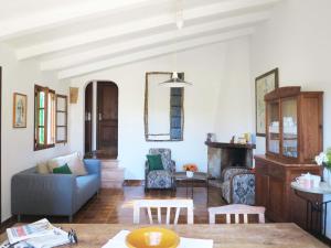 a living room with a couch and a table at Villa Font March in Pollença