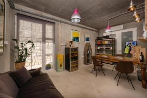 a living room with a wooden table and chairs at Belado Residence Bol in Bol