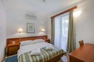 Posteľ alebo postele v izbe v ubytovaní Apartments Punta