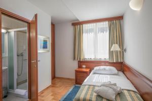Posteľ alebo postele v izbe v ubytovaní Apartments Punta