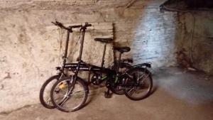 a bicycle is parked against a brick wall at Casa Nora in Lucca