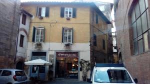 a white van parked in front of a building at Casa Nora in Lucca