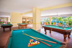una sala biliardo con due tavoli da biliardo e palle da biliardo di Breezes Resort & Spa All Inclusive, Bahamas a Nassau
